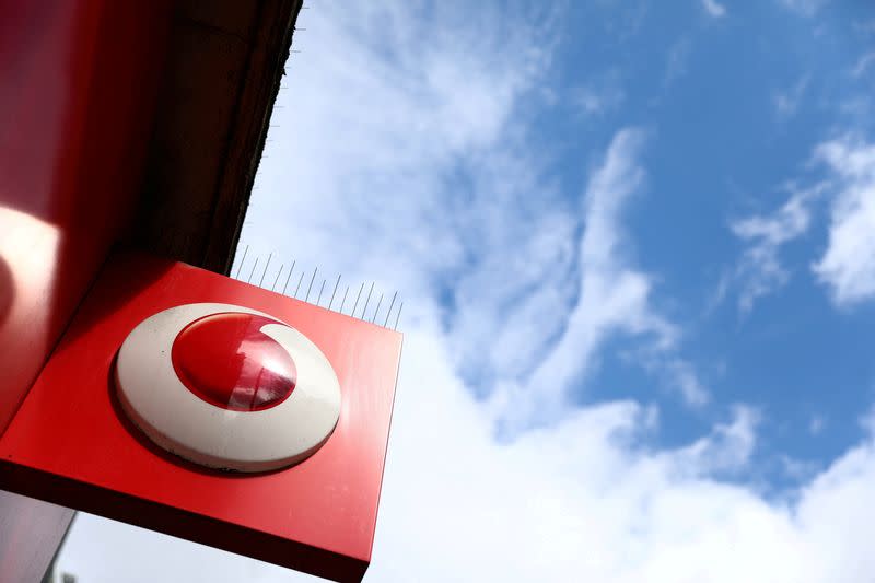 FILE PHOTO: A branded sign is displayed on a Vodafone store in London