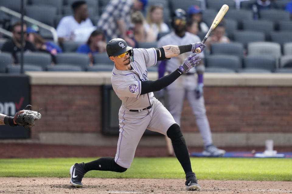 Colorado Rockies' Brenton Doyle hits an RBI single in the ninth inning of a baseball game against the New York Mets, Sunday, May 7, 2023, in New York. (AP Photo/John Minchillo)