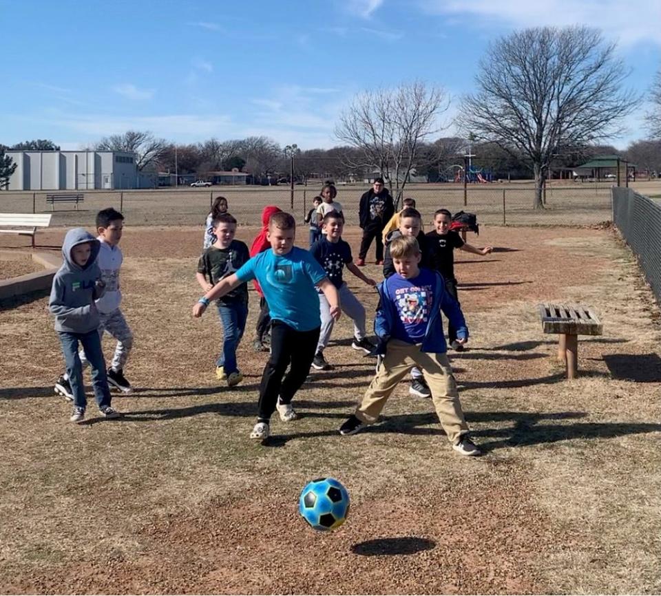 Cunningham Elementary students play outside on a sunny day - some of our current and future dreamers.