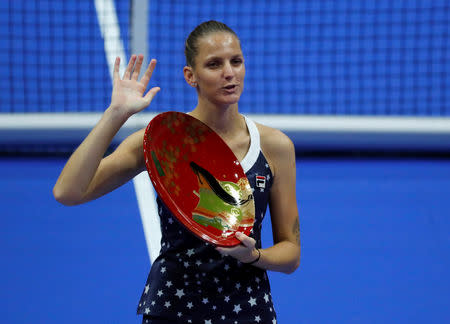 Tennis - Pan Pacific Open Women's Singles Final match - Arena Tachikawa Tachihi, Tokyo, Japan - September 23, 2018. Karolina Pliskova of Czech Republic kisses her victory trophy after defeating Naomi Osaka of Japan. REUTERS/Toru Hanai