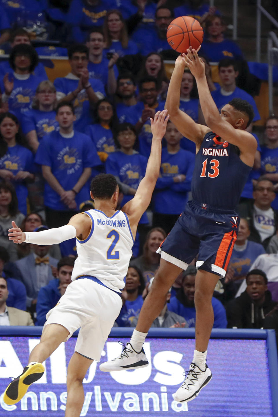 Virginia's Casey Morsell (13) shoots over Pittsburgh's Trey McGowens (2) during the first half of an NCAA college basketball game, Saturday, Feb. 22, 2020, in Pittsburgh. (AP Photo/Keith Srakocic)