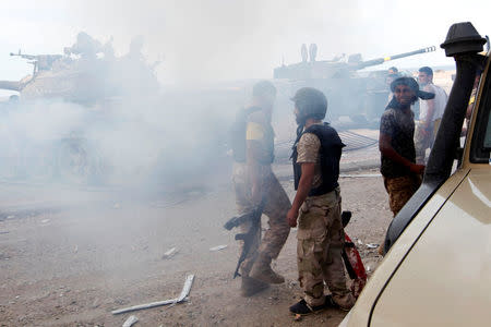 Libyan forces allied with the U.N.-backed government gather at the eastern frontline of fighting with Islamic State militants, in Sirte's neighbourhood 650, Libya, October 21, 2016. REUTERS/Ismail Zitouny