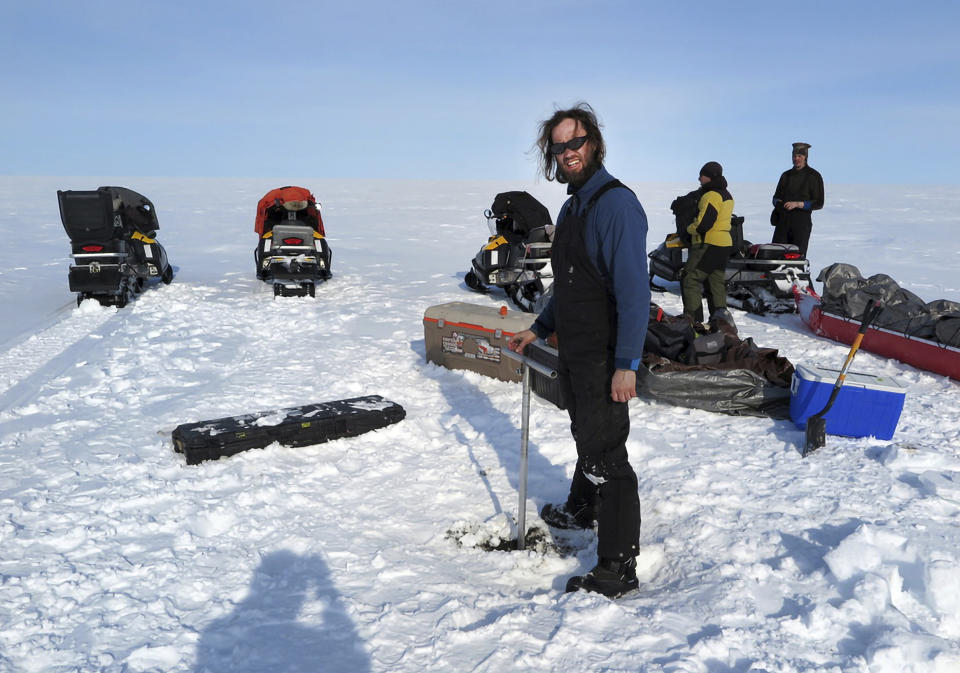 This photo taken in 2015 north of Teshekpuk Lake on Alaska's North Slope shows scientist Ronald Daanen researching permafrost. Daanen was among three state workers and the pilot who died when their helicopter crashed on July 20, 2023, on Alaska's North Slope. (Benjamin Jones via AP)