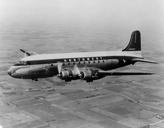 A black-and-white photo of a Northwest Airlines DC-4.