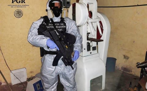 A chemical specialist in a protective suit is seen at a clandestine drug processing laboratory of fentanyl located in the Azcapotzalco - Credit: &nbsp;REUTERS