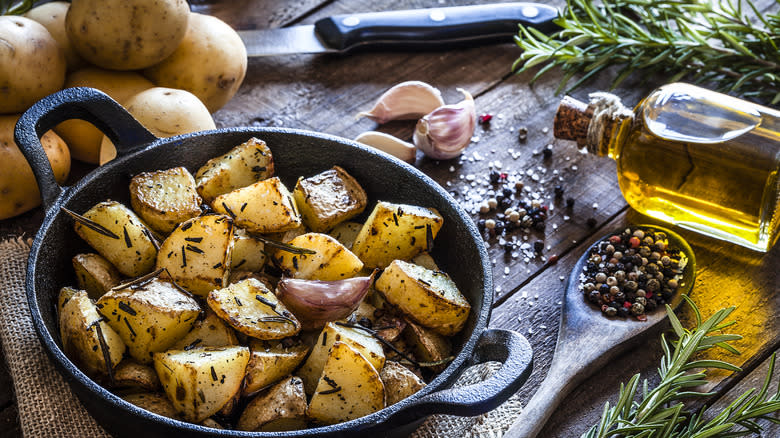 Seasoned, roasted potatoes in a cast-iron skillet