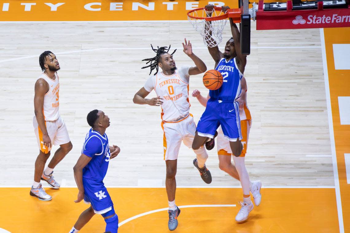 Kentucky Wildcats guard Antonio Reeves (12) dunks to score against Tennessee Volunteers forward Jonas Aidoo (0) during the game at Thompson-Boling Arena in Knoxville, Tn, Saturday, March 9, 2024. Silas Walker/swalker@herald-leader.com