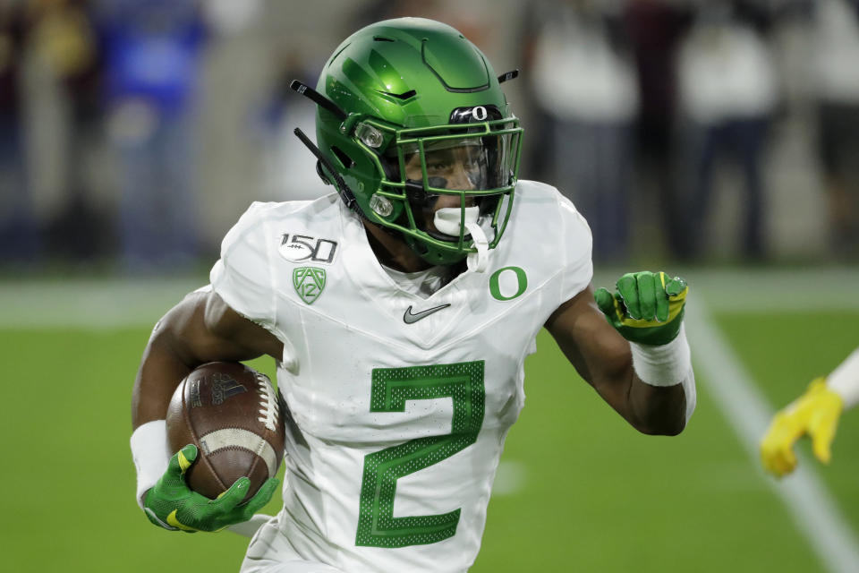 Oregon's Mykael Wright (2) carries on a kick return during the first half of the team's NCAA college football game against the Arizona State, Saturday, Nov. 23, 2019, in Tempe, Ariz. (AP Photo/Matt York)