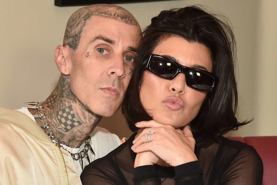 <p>Getty Images</p> Travis Barker and Kourtney Kardashian