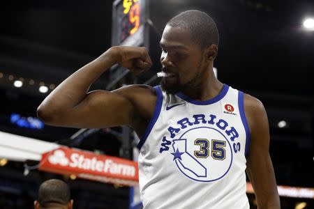 Dec 1, 2017; Orlando, FL, USA; Golden State Warriors forward Kevin Durant (35) flex his muscles as he made a basket in the act of getting fouled against the Orlando Magic during the second quarter at Amway Center. Mandatory Credit: Kim Klement-USA TODAY Sports