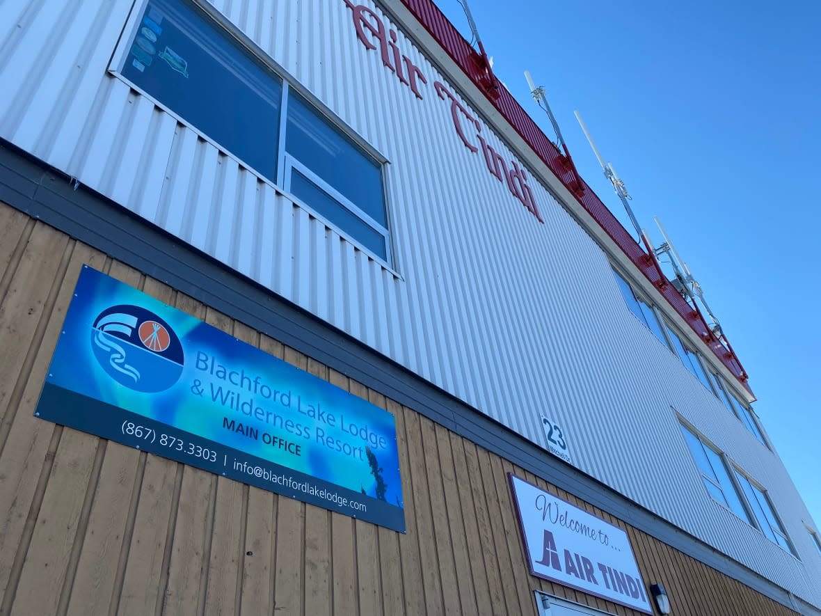 A sign over the Yellowknife office of Blachford Lake Lodge. Guests and staff were blindsided by an email last week announcing that all operations would cease.  (Graham Shishkov/CBC - image credit)