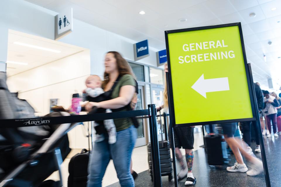 Travelers walk through security at the Salt Lake City International Airport in Salt Lake City on Friday, May 19, 2023. | Ryan Sun, Deseret News