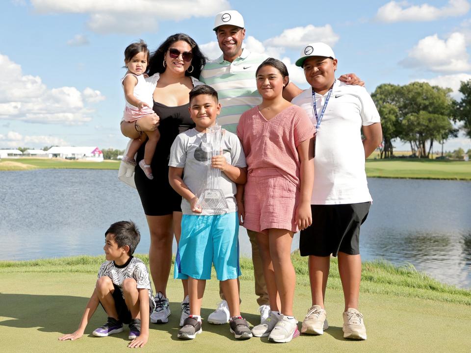 Tony Finau of the United States and his wife Alayna Finau pose with their children after Finau won the 3M Open at TPC Twin Cities on July 24, 2022 in Blaine, Minnesota