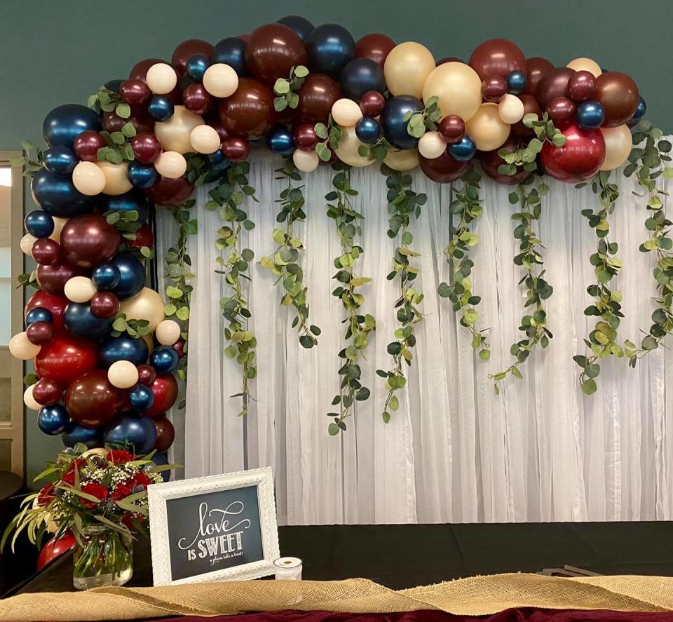 Balloons decorate a bridal shower. According to Lisa Higgins, owner of West Michigan Balloons, two balloons can be used to create a unique shade.