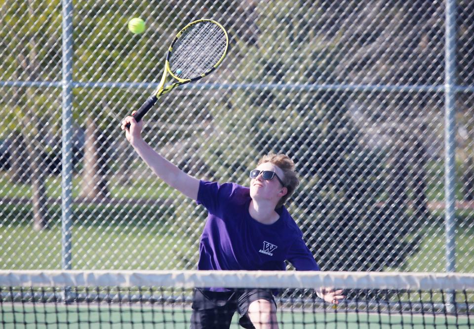 Watertown's Curtis Sneden charges the net in a first-flight singles match during the Eastern South Dakota Conference boys tennis tournament on Tuesday, May 9, 2023 in Mitchell.