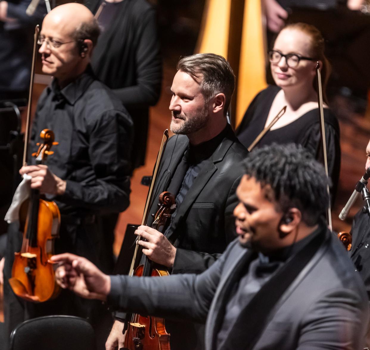 Peter Otto, center, the Nashville Symphony’s new concertmaster, stands facing the crowd during the performance of "Encanto" Saturday, March 16, 2024, at Schermerhorn Symphony Center.