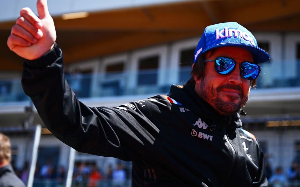 Fernando Alonso of Spain and Alpine F1 waves to the crowd on the drivers parade ahead of the F1 Grand Prix of Canada at Circuit Gilles Villeneuve on June 19, 2022 in Montreal, Quebec - Clive Mason/Getty Images North America