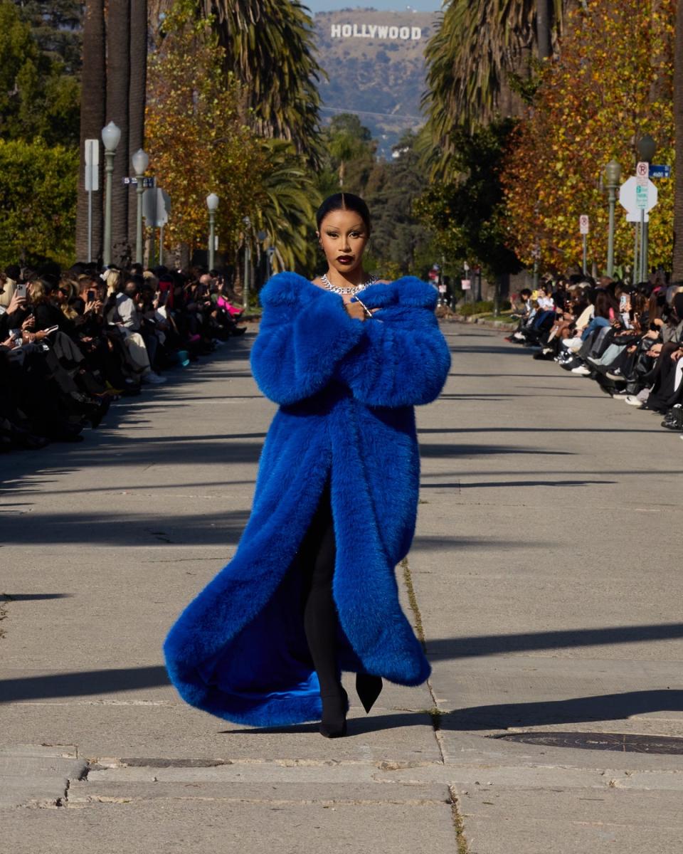 Cardi B closing the show in an epic cobalt coat.