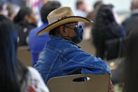 Residents of Gila River Indian Community listen during a "Road to Healing" event, Friday, Jan. 20, 2023, at the Gila Crossing Community School in Laveen, Ariz. The "The Road to Healing," is a year-long tour across the country to provide Indigenous survivors of the federal Indian boarding school system and their descendants an opportunity to share their experiences. (AP Photo/Matt York)