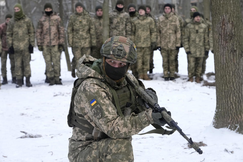 An instructor trains members of Ukraine's Territorial Defense Forces, volunteer military units of the Armed Forces, in a city park in Kyiv, Ukraine, Saturday, Jan. 22, 2022. Dozens of civilians have been joining Ukraine's army reserves in recent weeks amid fears about Russian invasion. / Credit: Efrem Lukatsky / AP