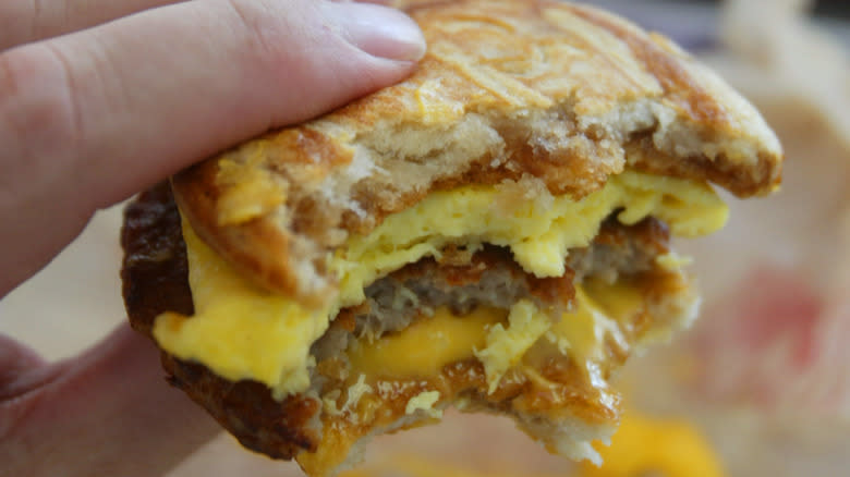 half-eaten sausage egg McMuffin