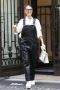 <p>In Givenchy faux leather overalls, a white button-down shirt, Kanye West x Giuseppe Zanotti sandals, and jewel-embellished sunglasses in Paris. </p>