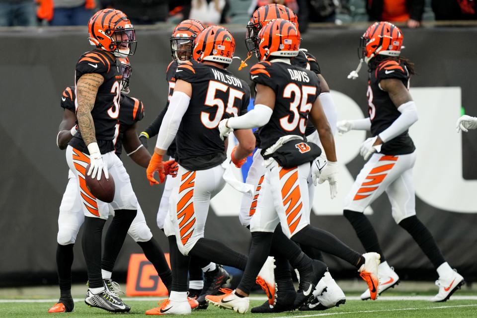 Cincinnati Bengals safety Jessie Bates III (30) and the defense celebrate an interception in the fourth quarter during a Week 14 NFL game against the Cleveland Browns, Sunday, Dec. 11, 2022, at Paycor Stadium in Cincinnati. The Cincinnati Bengals won, 23-10. Mandatory Credit: Kareem Elgazzar-The Cincinnati Enquirer-USA TODAY Sports