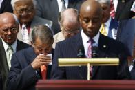 U.S. House Speaker John Boehner (R-OH) (L) wipes away tears after speaking at a remembrance of lives lost in the 9/11 attacks, at the U.S. Capitol in Washington, September 11, 2013. Bagpipes, bells and a reading of the names of the nearly 3,000 people killed when hijacked jetliners crashed into the World Trade Center, the Pentagon and a Pennsylvania field marked the 12th anniversary of the September 11 attacks in 2001. (REUTERS/Jonathan Ernst)