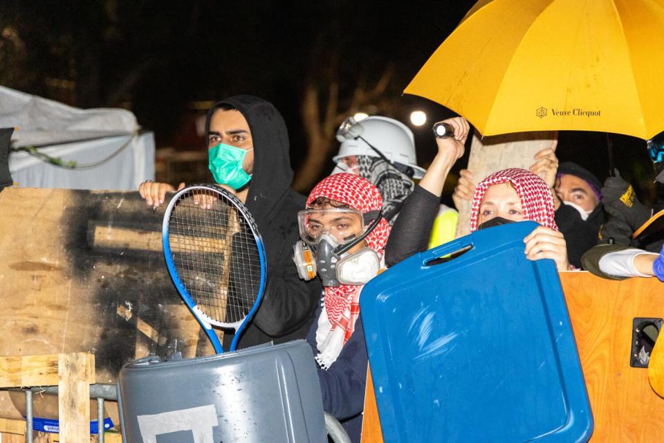 Pro-Palestinian protesters guard their encampment.