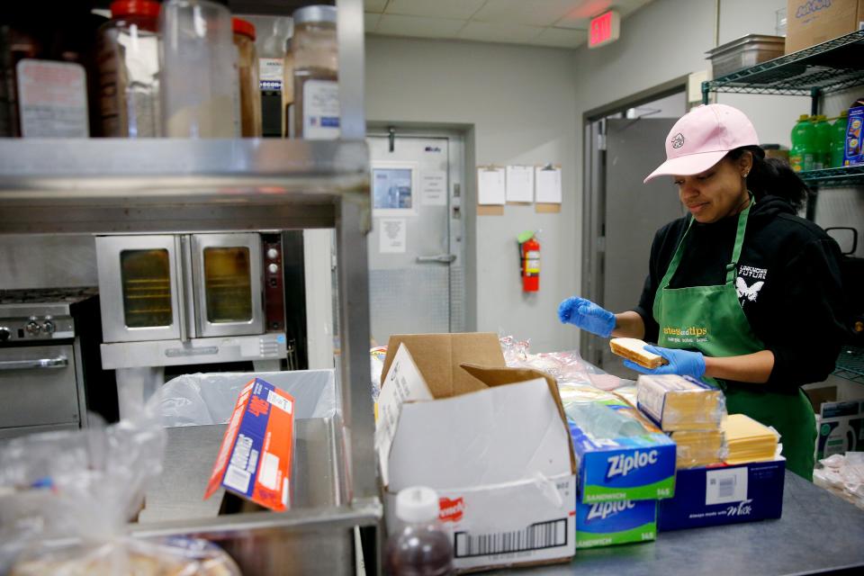 Volunteer Melody Phillips works Thursday inside the day shelter kitchen at the Homeless Alliance in Oklahoma City during a winter storm.