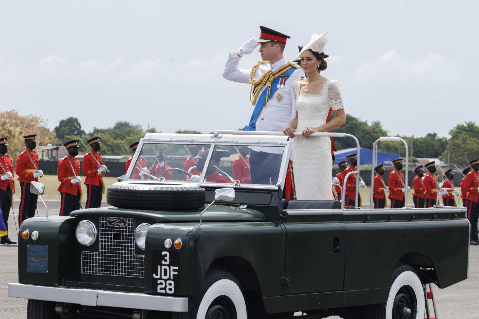 KINGSTON, JAMAICA – MARCH 24: (UK OUT FOR 28 DAYS) Catherine, Duchess of Cambridge and Prince William, Duke of Cambridge ride in a Land Rover as they attend the inaugural Commissioning Parade for service personnel from across the Caribbean with Prince William, Duke of Cambridge, at the Jamaica Defence Force on day six of the Platinum Jubilee Royal Tour of the Caribbean on March 24, 2022 in Kingston, Jamaica. The Duke and Duchess of Cambridge are visiting Belize, Jamaica, and The Bahamas on their week-long tour. (Photo by Pool/Samir Hussein/WireImage)