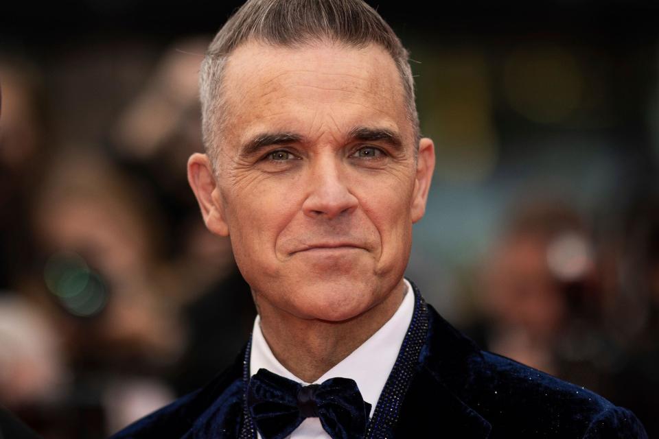 Robbie Williams poses for photographers upon arrival at the premiere of the film 'Killers of the Flower Moon' at the 76th international film festival, Cannes, southern France, Saturday, May 20, 2023. (Photo by Vianney Le Caer/Invision/AP)