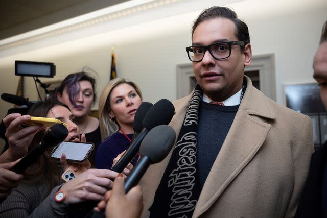 Francis Chung/POLITICO via AP Images Rep. George Santos is questioned by reporters on Capitol Hill