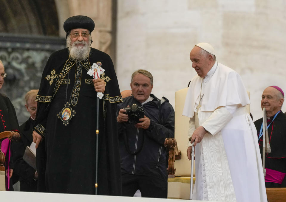 Pope Francis, right, arrives for his weekly general audience in St. Peter's Square at The Vatican, with the leader of the Coptic Orthodox Church of Alexandria, Tawadros II,Wednesday, May 10, 2023. (AP Photo/Alessandra Tarantino)