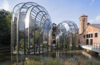 The former paper mill Laverstoke Mill distillery located on the River Test in Laverstoke, southern England, in 2015, that hosts over 100,000 visitors per year at the Bombay Sapphire gin distillery. Many people now like to know more about their food and drink and where it comes from, leading to a boom in so-called ``spirit tourism’’ with artisan brands and micro distilleries popping up across the United Kingdom. (Iwan Baan/Bacardi Ltd via AP)