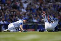 Chicago Cubs catcher Yan Gomes collides with Chicago Cubs starting pitcher Drew Smyly, preventing the throw to first base and ending his chance at a perfect game during the eighth inning of a baseball game against the Los Angeles Dodgers Friday, April 21, 2023, in Chicago. (AP Photo/Erin Hooley)