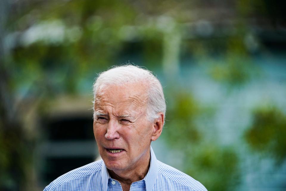 President Joe Biden speaks in front of a home destroyed by fallen trees and debris during a tour of communities impacted by Hurricane Idalia, in Live Oak, Florida, on Sept. 2, 2023.