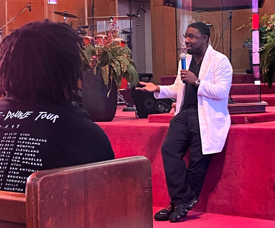 Dr. Corey Finch talks to young people during an opening session of "Exposure to Excellence," a back-to-school youth conference continuing through Thursday at Fifth Street Baptist Church, 801 NE 5. 