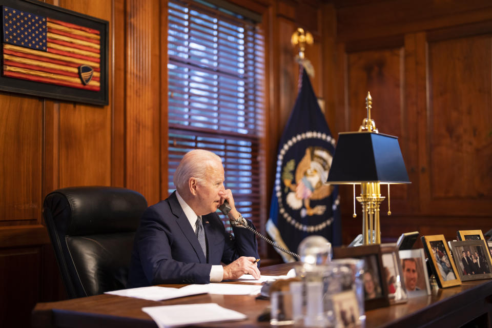 In this image provided by The White House, President Joe Biden speaks with Russian President Vladimir Putin on the phone from his private residence in Wilmington, Del., Thursday, Dec. 30, 2021. (Adam Schultz/The White House via AP)