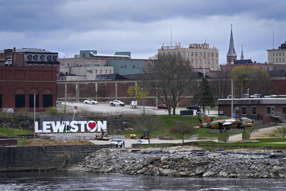 A sign decorates a riverfront park, Wednesday, May 1, 2024, in Lewiston, Maine. The city was the scene of the state's deadliest mass shooting last October. (AP Photo/Robert F. Bukaty)