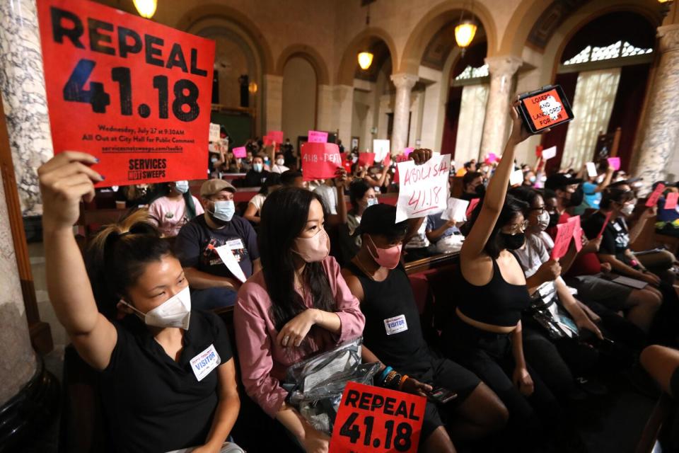 Homeless advocates and protesters fill the chamber before the Los Angeles City Council cast its final vote