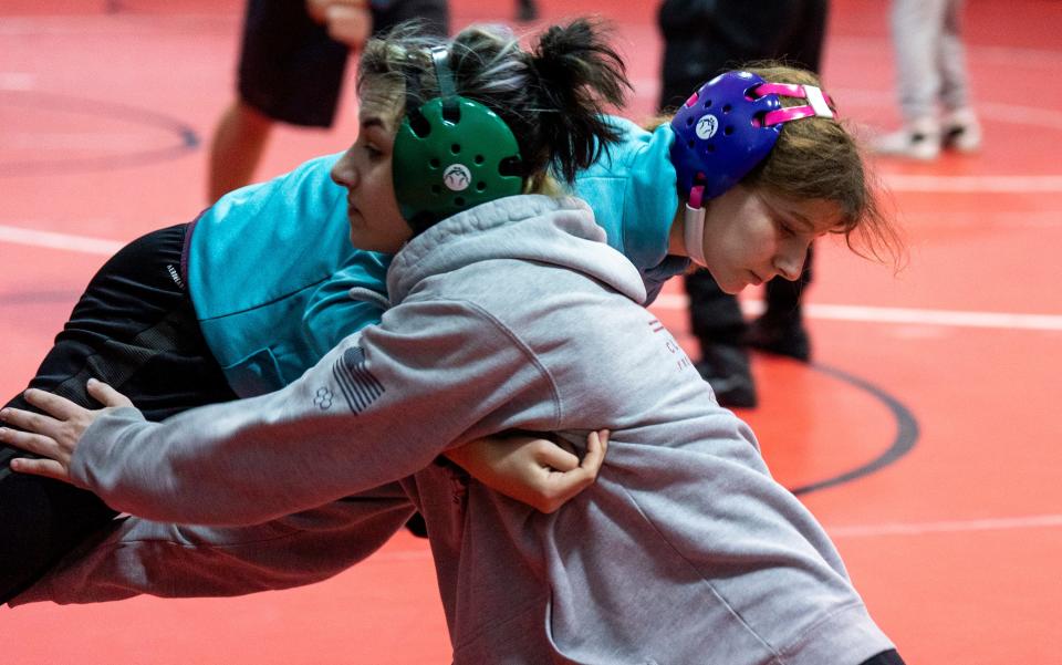 Emily Sarr, back, against Gisele Ramirez, front, during Souderton girls' wrestling practice in Souderton on Friday, Jan. 12, 2024.

Daniella Heminghaus | Bucks County Courier Times