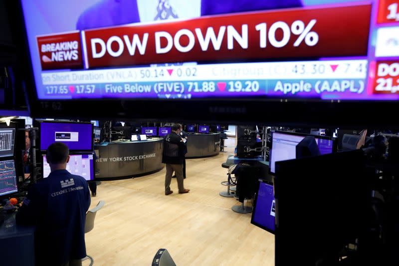 A trader walks from the floor of the New York Stock Exchange (NYSE) after the close of trading in New York