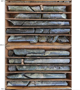 Core from drill hole #11 showing sulphide mineralization at Broad Top Butte (intersected 6.53% copper from 687 to 704 feet).