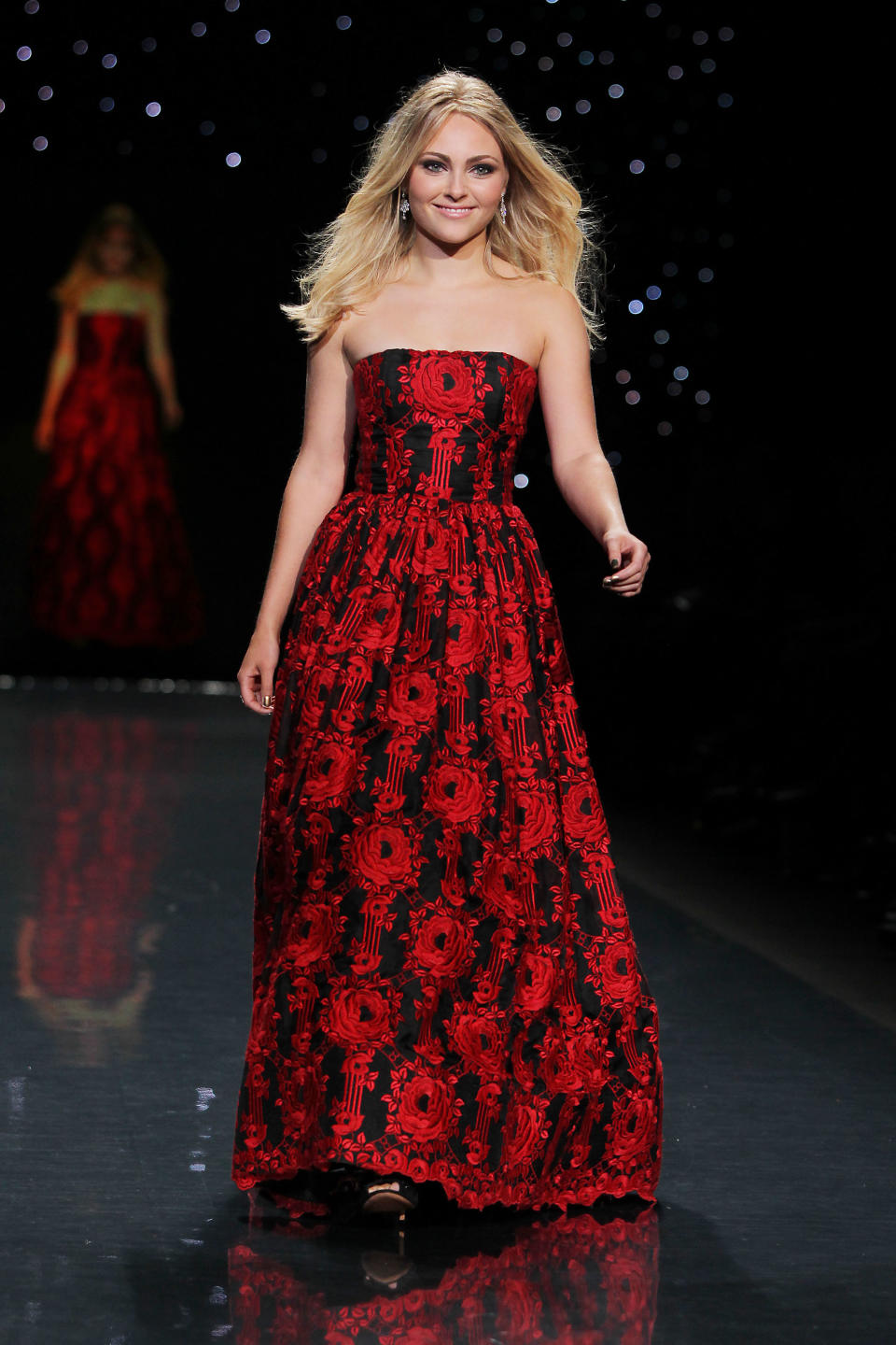 This Feb. 6, 2014 photo released by Starpix shows actress AnnaSophia Robb wearing Alice + Olivia as she participates in the Go Red For Women-The Heart Truth Red Dress Collection show during Fashion Week in New York. (AP Photo/Starpix, Amanda Schwab)