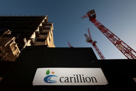 FILE PHOTO: A logo is seen in front of cranes standing on a Carillion construction site in central London, Britain, January 16, 2018. REUTERS/Simon Dawson/File Photo