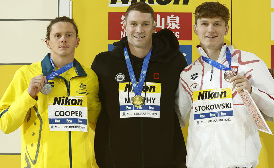 Isaac Cooper, Ryan Murphy and Kacper Stokowski, pictured here with their medals at the short course world swimming championships. 
