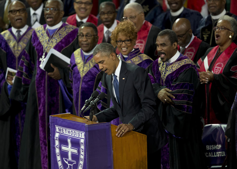 FILE - In this June 26, 2015, file photo, President Barack Obama sings "Amazing Grace" during services honoring the life of Rev. Clementa Pinckney, at the College of Charleston TD Arena in Charleston, S.C. In moments of crisis, American presidents have sought to summon words to match the moment in the hope that the power of oratory can bring order to chaos and despair. (AP Photo/Carolyn Kaster, File)