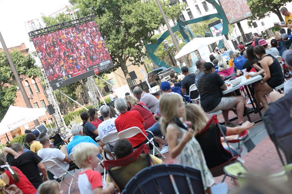 Iowa State and Iowa fans watch the 2021 Cy-Hawk game during the Touchdown Tailgate at Cowles Commons last year.