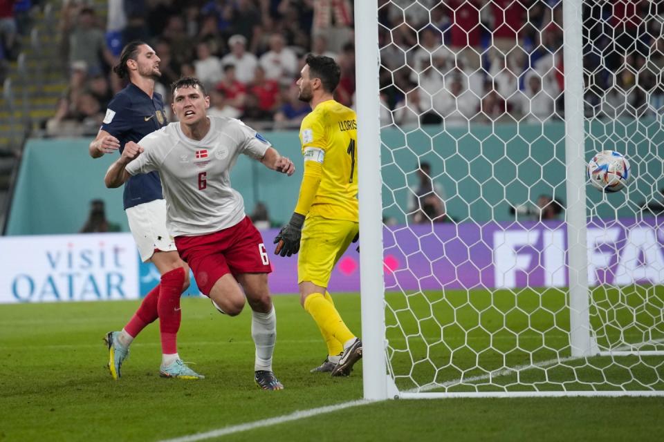 Denmark's Andreas Christensen celebrates after scoring his side's first goal during the World Cup group D football match between France and Denmark, at the Stadium 974 in Doha, Qatar, Saturday, Nov. 26, 2022. (AP Photo/Christophe Ena)